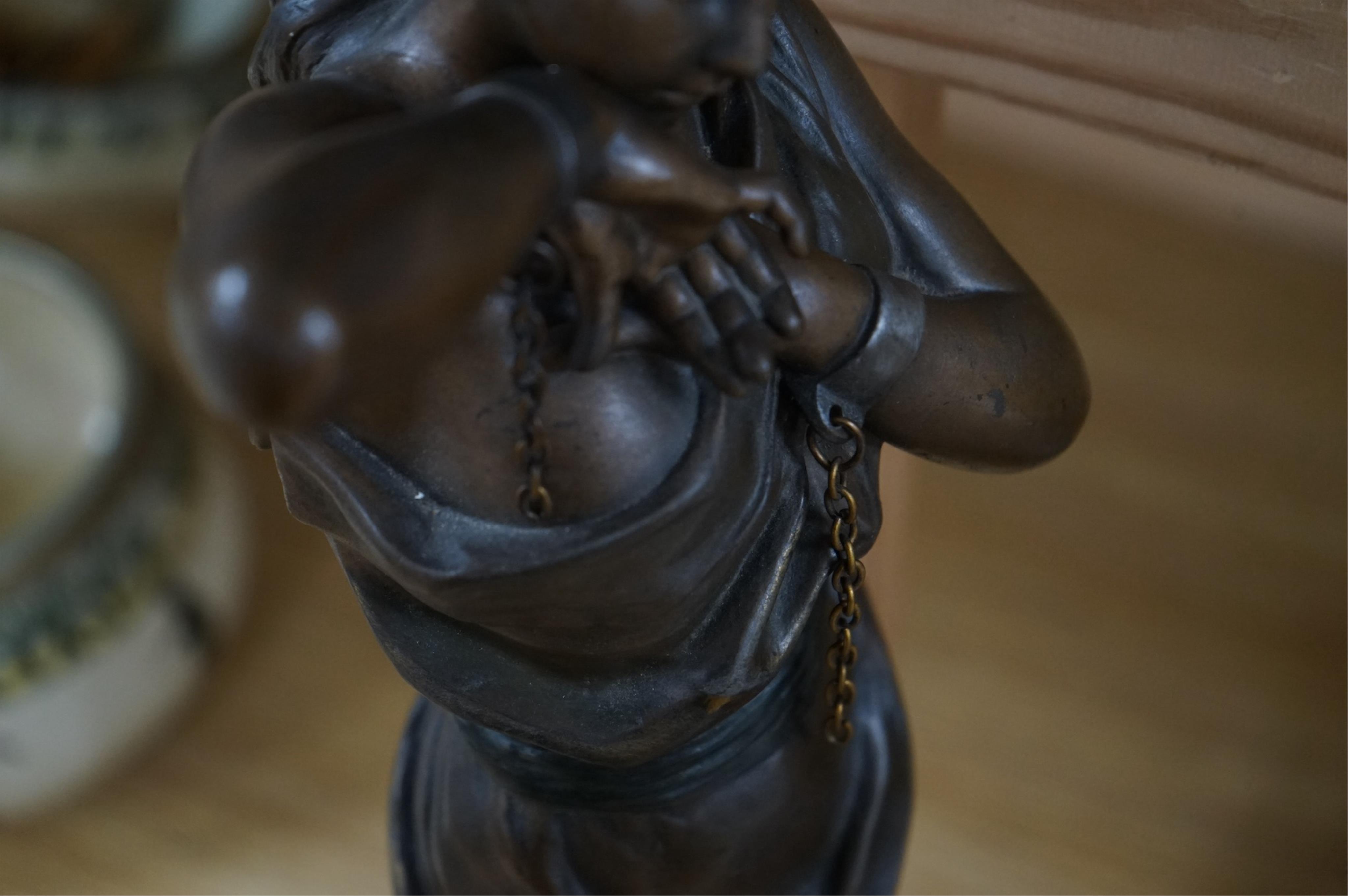 A bronzed spelter figure of a bound woman, signed E. Villanis, 56cm high. Condition - good, chain broken